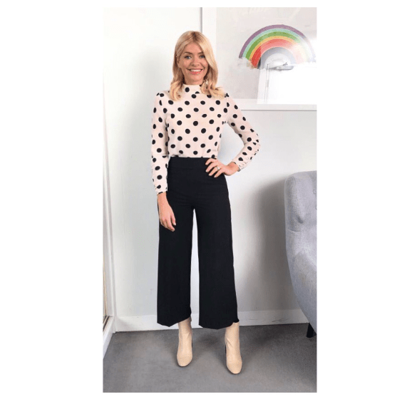 Holly Willoughby outfit blog white and blacl polka dot top black trousers cream boots This Morning January 2018