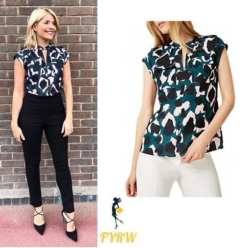 Holly Willoughby This Morning outfit style blue multi sleeveless top black trousers black cross strap shoes May 2018