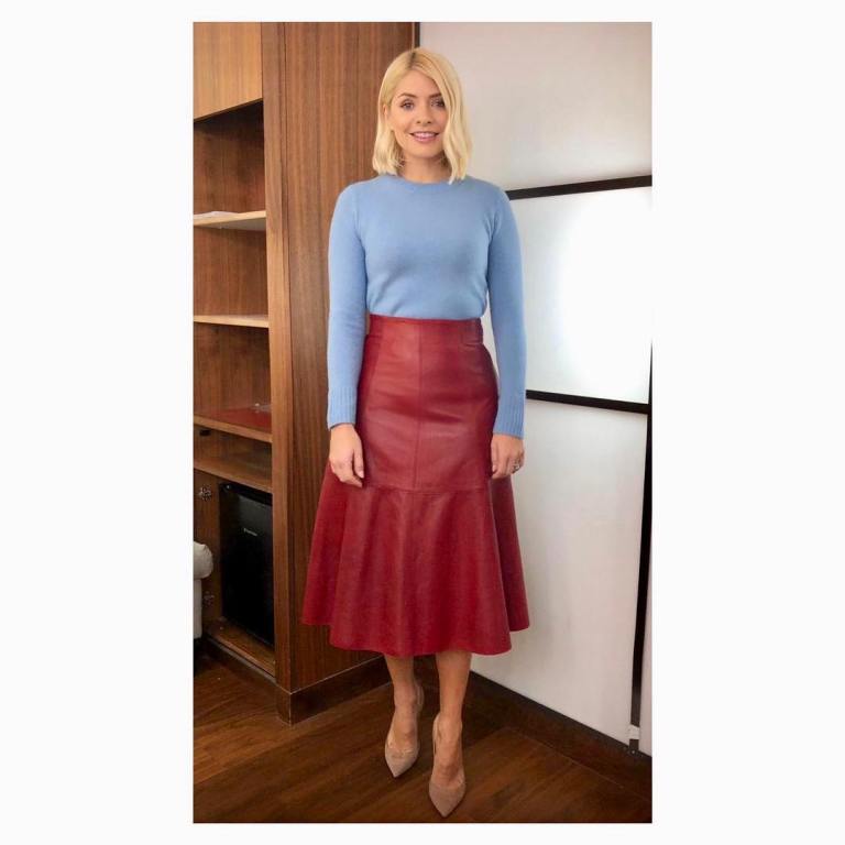 where to get Holly Willoughby This Morning outfit today red leather midi skirt blue jumper nude court shoes February 2019 photo Holly Willoughby