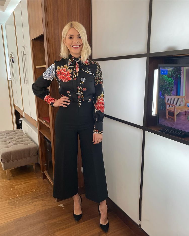 where to get all holly Willoughby This Morning outfits Japanese floral black shiet black wide leg trousres black suede court shoes 11 February 2021 Photo Holly Willoughby