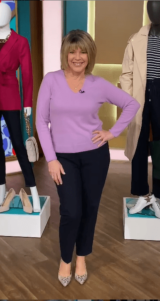 where to get all Ruth Langsford This Morning outfits lilac v neck sweater navy trousers snakeskin court shoes 6 April 2021 Photo Ruth Langsford