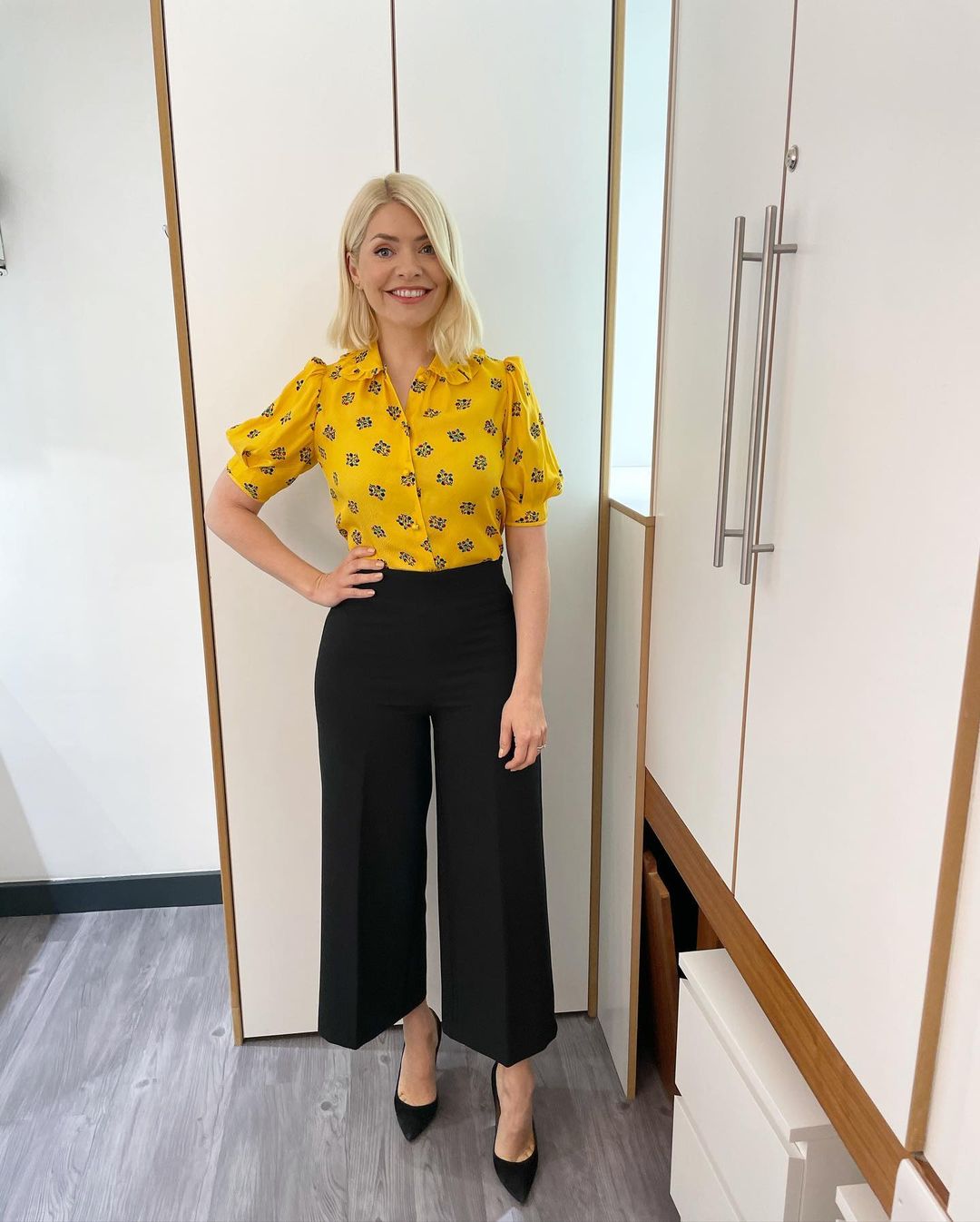 where to get all Holly Willoughby this Morning outfits yellow floral blouse black culottes black suede court shoes 18 May 2021 Photo Holly Willoughby