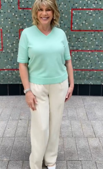 where to get all Ruth Langsford This Morning outfits green v neck knit stone trousers white court shoes 28 July 2021 Photo Ruth Langsford
