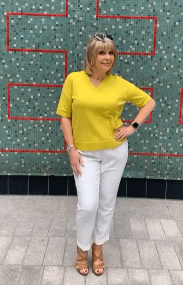 where to get Ruth Langsford This Morning outfits yellow v neck jumper white trousers tan sandals 15 July 2021 Photo Ruth Langsford