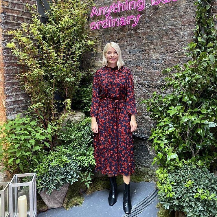 where to get all Holly Willoughby dresses red and black florl long sleeve midi dress black ankle boots Anything But Ordinary 8 September 2021 Photo M&S