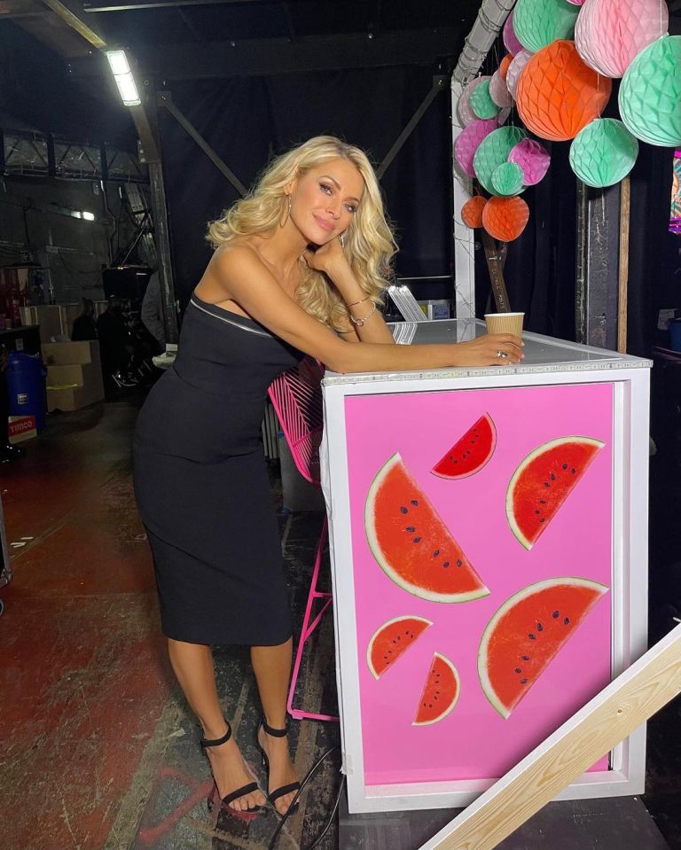 where to get Tess Daly Strictly dresses black strapless dress silver trim black sandals 24 October 2021 Photo Tess Daly