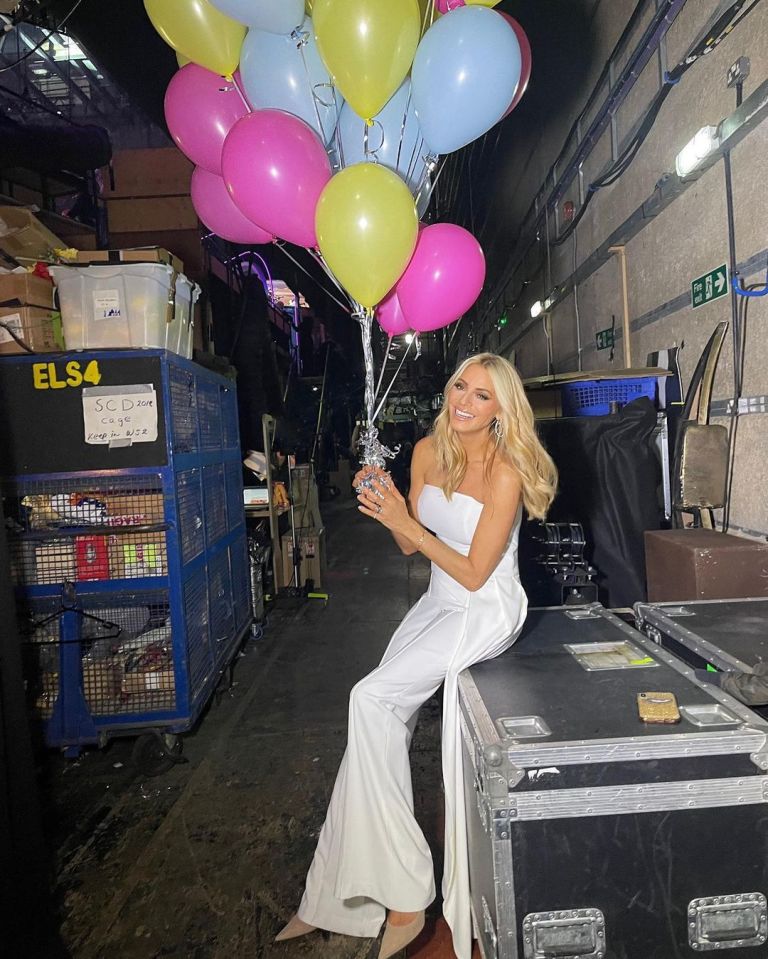 where to get Tess Daly Strictly outfits white strapless jumpsuit tie belt nude suede court shoes 17 October 2021 Photo Tess Daly
