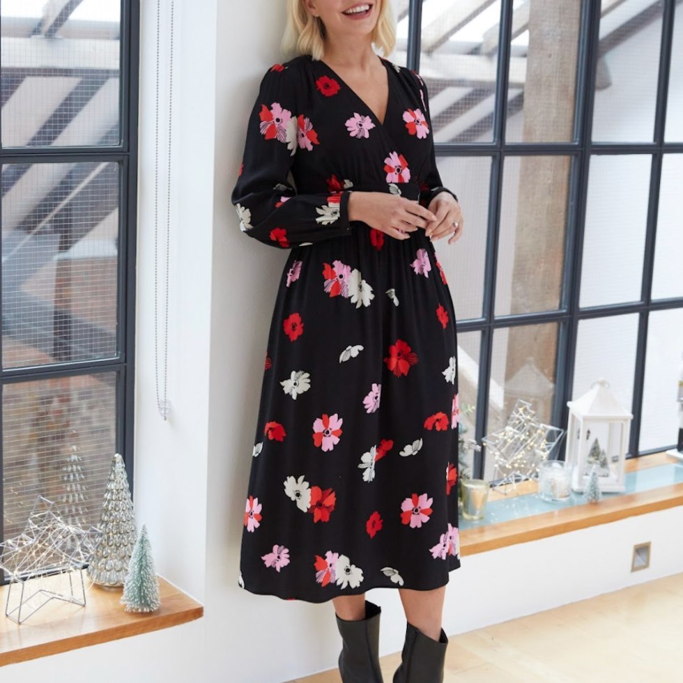 where to get all Holly Willoughby dresses black V neck floral tea dress black ankle boots 15 November 2021 photo M&S