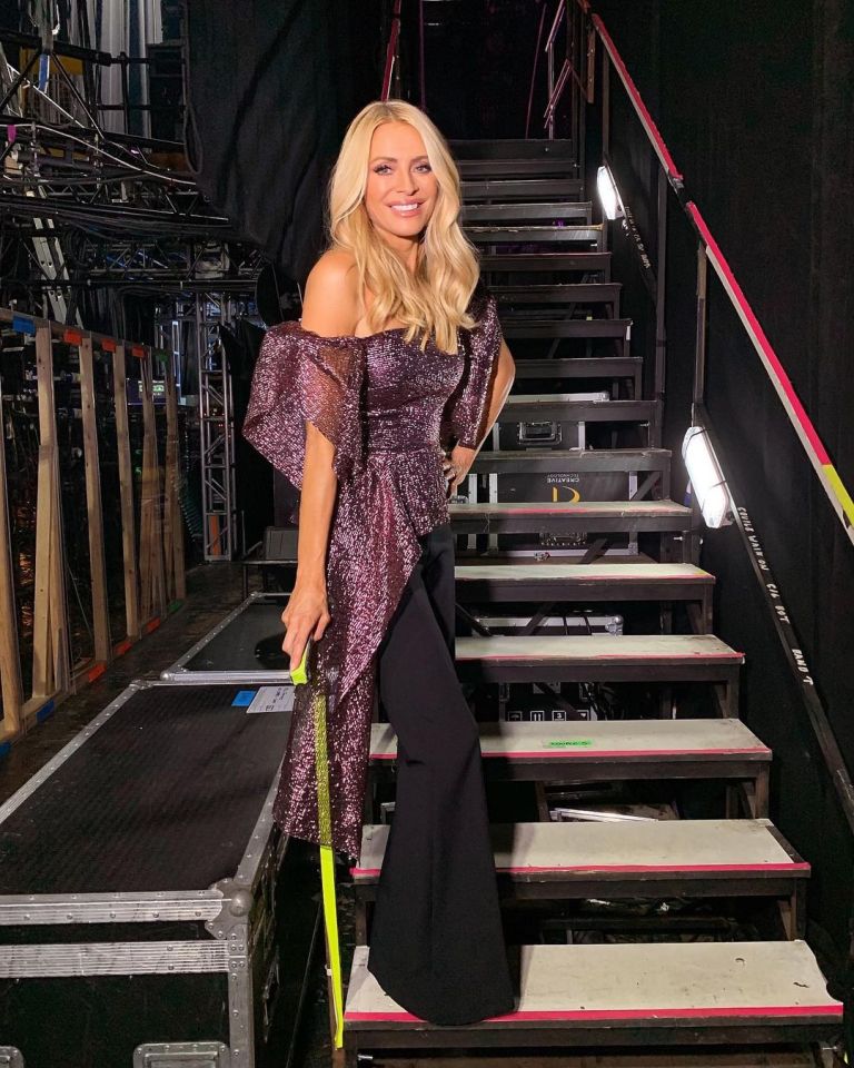 where to get all Tess Daly Strictly outfits pink purple metallic off the shoulder top black flare trousers 7 November 2021 Photo Tess Daly
