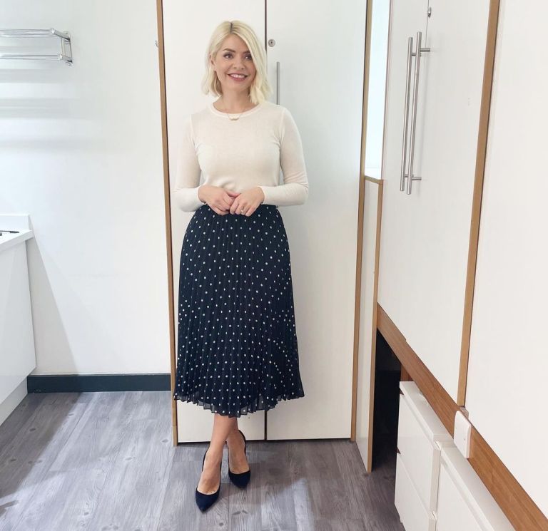 where to get all Holly Willoughby This Morning navy pleated spot skirt cream ivory knit navy suede court shoes 3 March 2022 Photo Holly Willoughby