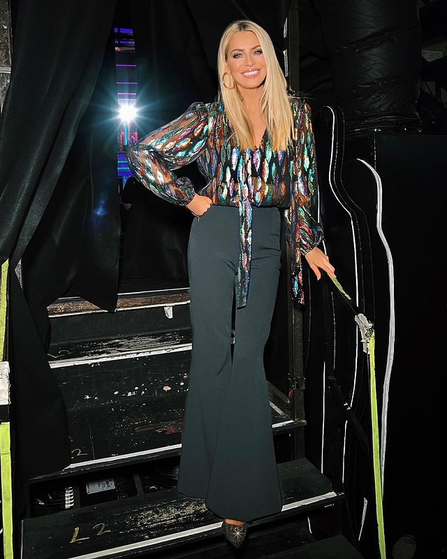 where to get all Tess Daly Dtrictly outfits metallic fil coupe blouse black trousers glitter pumps 2 October 2022 Photo Tess Daly