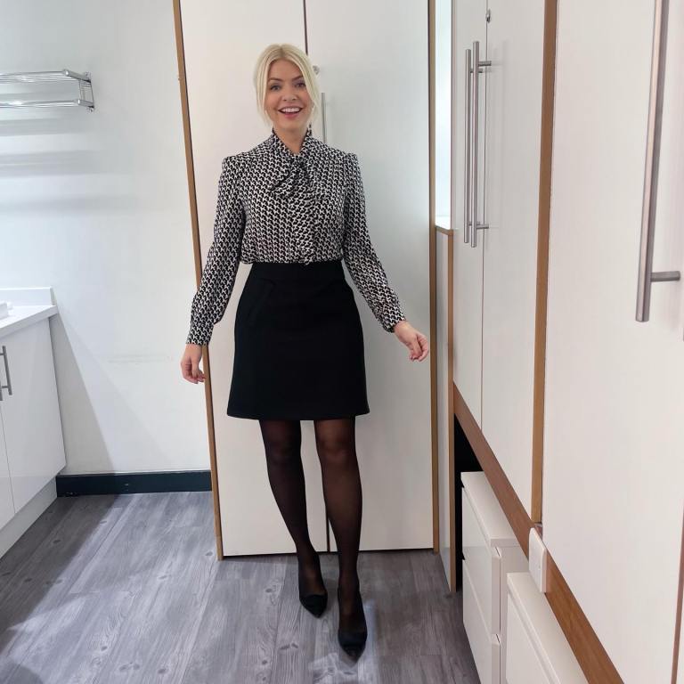 where to get all Holly Willoughby This Morning outfits black and white poodle print tie neck blouse black mii skirt black suede court shoes 4 October 2022 Photo Holly Willoughby