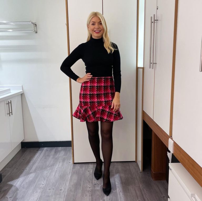where to get all Holly Willoughby This Morning outfits dresses pink and black tweed mini skirt black polo neck knit black suede court shoes 24 October 2022 Photo Holly Willoughby