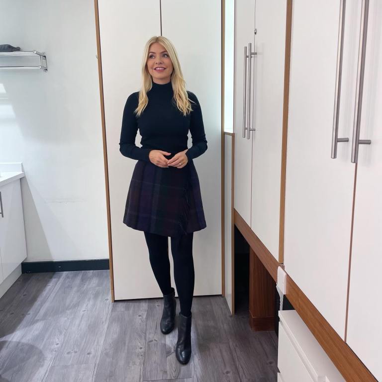 where to get all Holly Willoughby This Morning outfits dressespurple and green fringed plaid skirt black polo neck knit black ankle boots 26 October 2022 Photo Holly Willoughby