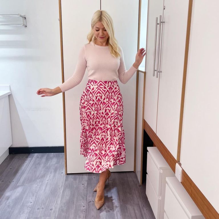 where to get all Holly Willoughby This Morning outfits pink abstract print pleated skirt pink crew neck jumper nude suede court shoes 10 October 2022 Photo Holly Willoughby