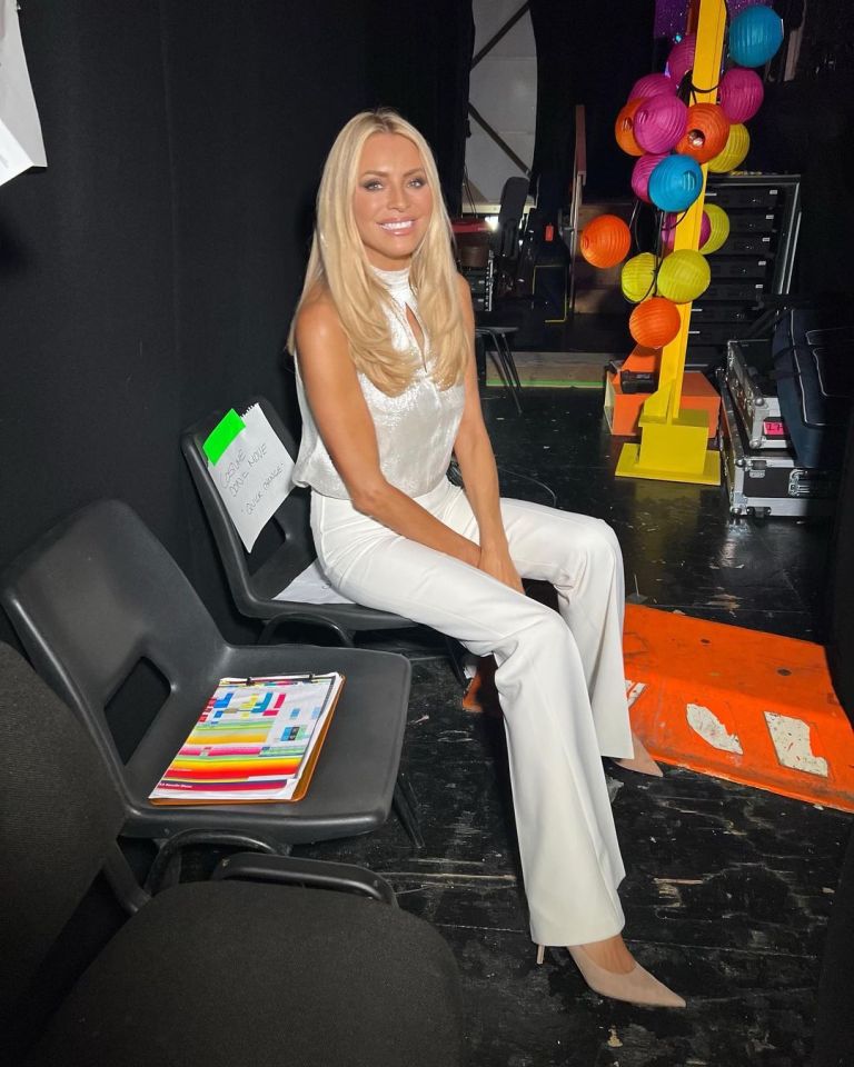 where to get all Tess Daly Strictly Come Dancing outfits cream textured halter top cream flared trousers nude court shoes 16 October 2022 Photo Tess Daly