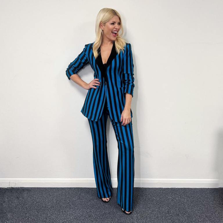where to get all Holly Willoughby Celebrity Juice outfits cyan blue and black striped trouser suit 29 November 2022 Photo Holly Willoughby