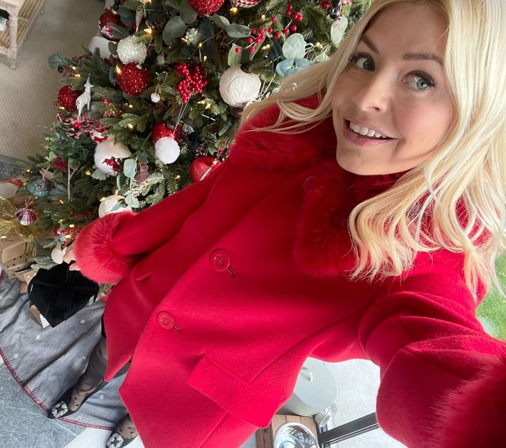 where to get all Holly Willoughby outfits red faux fur trim coat 23 December 2022 Photo Holly Willoughby