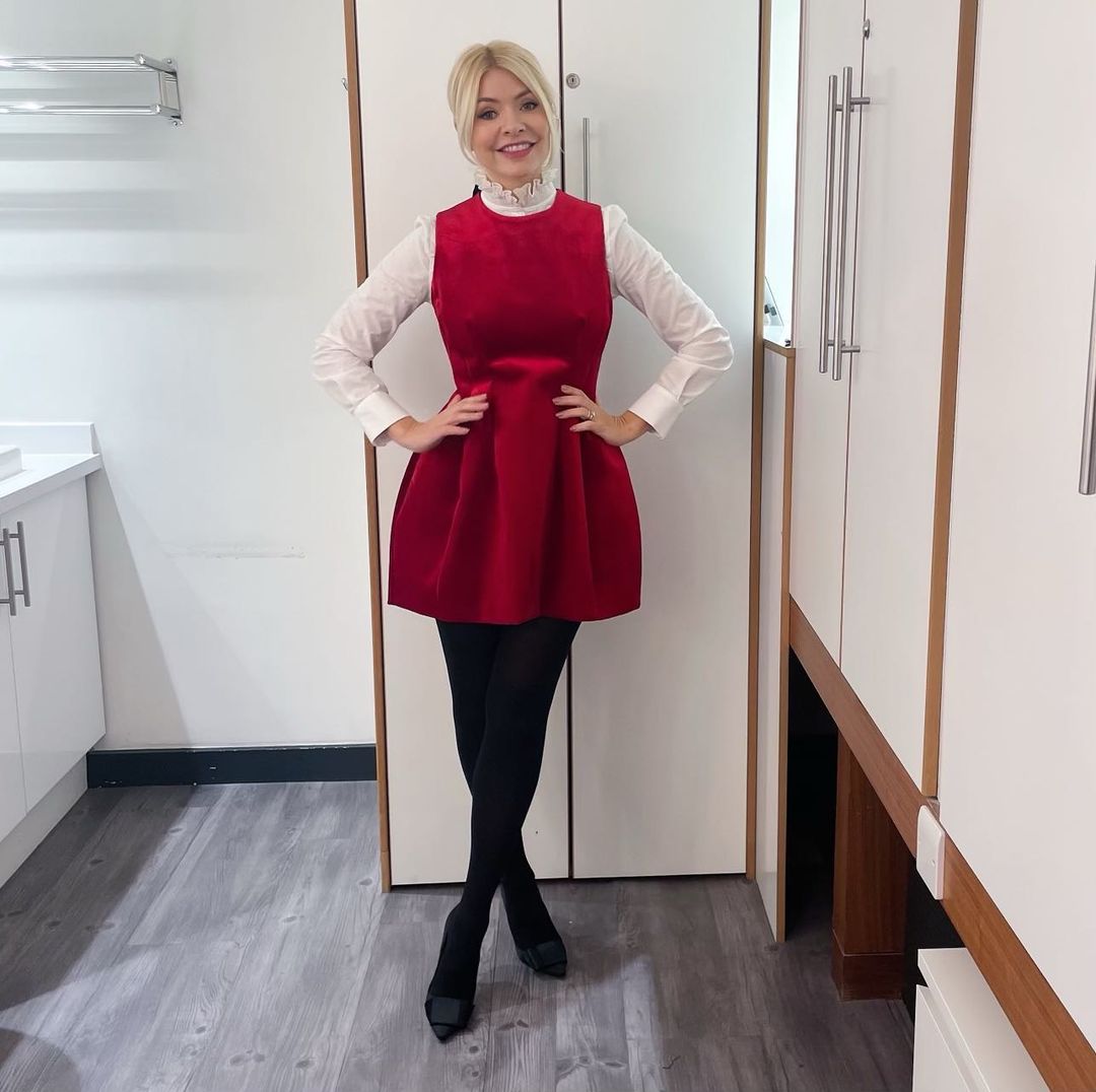 where to get all Holly Willoughby This Morning dresses red velvet mini dress white ruffle collar blouse black silk bow court shoes 6 December 2022 Photo Holly Willoughby