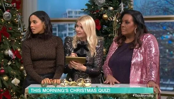 where to get all Holly Willoughby This Morning dresses silver sequin mini dress black bows 25 December 2022 Photo ITV