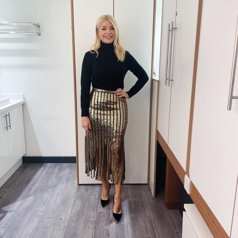 where to get all Holly Willoughby This Morning outfits knitwear black roll neck knitwear gold fringe skirt black suede court shoes 5 December 2022 Photo Holly Willoughby