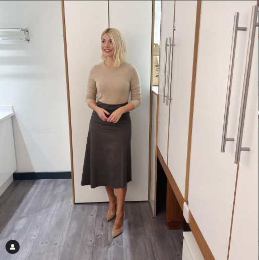 where to get all Holly Willoughby This Morning outfits grey asymmetric midi skirt beige camel crew neck jumper nude suede curt shoes 23 January 2023 Photo Holly Willoughby
