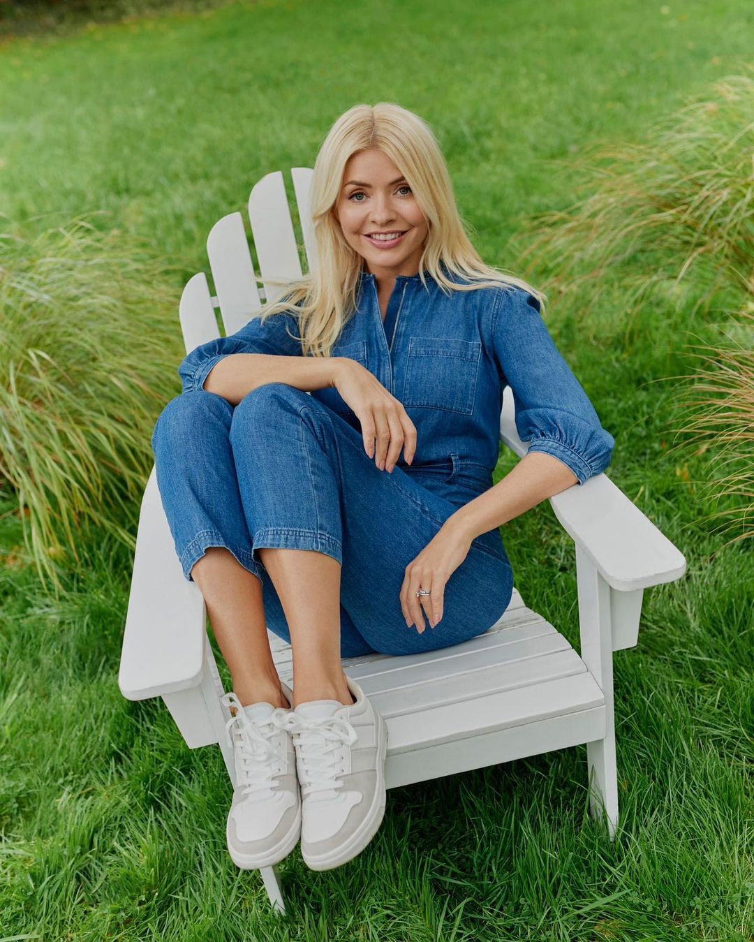 where to get all Holly Willoughby outfits belted denim jumpsuit white and grey trainers 9 February 2023 Photo M&S