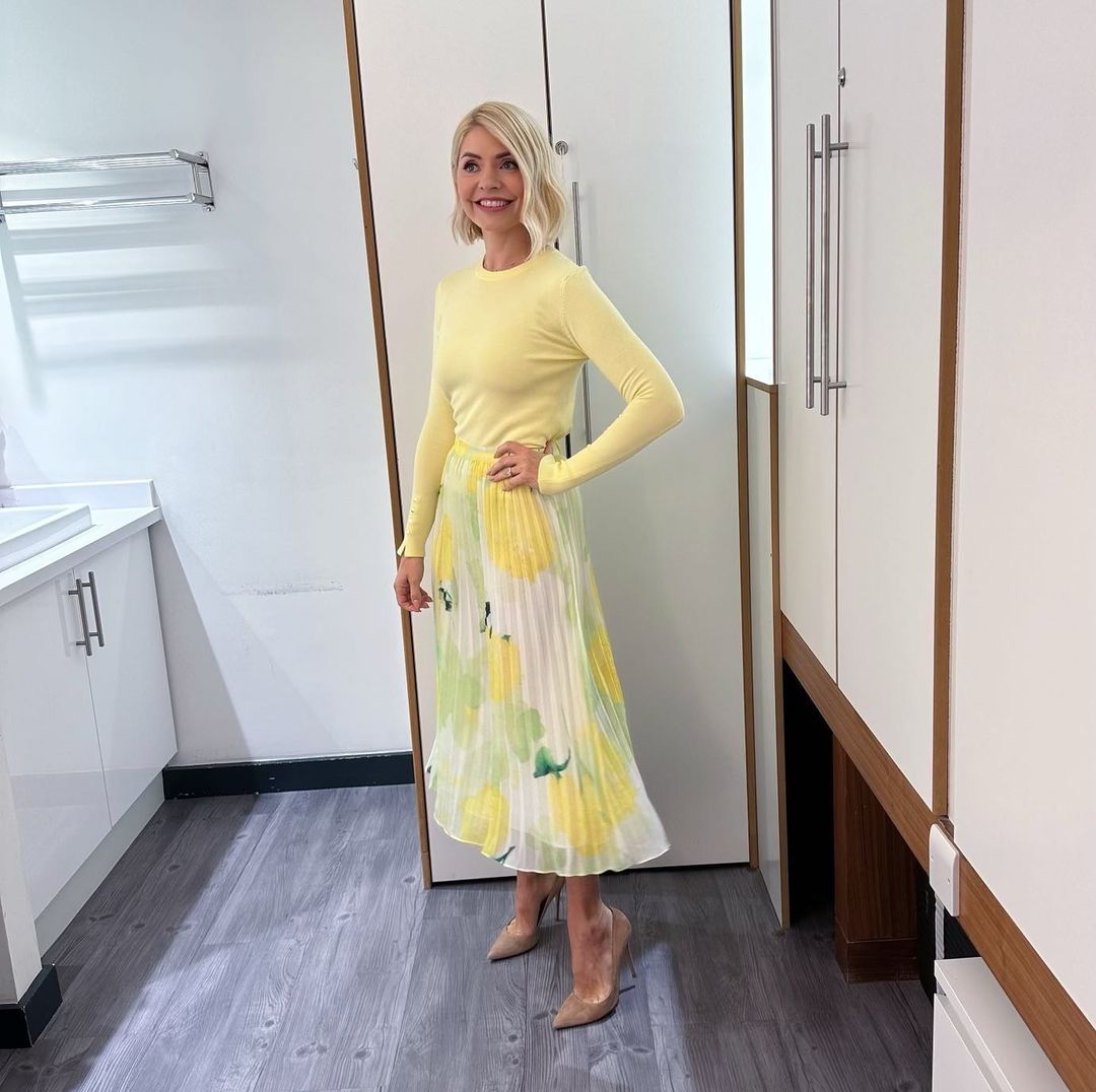 where to get all Holly Willoughby This Morning outfits yellow lemon pleated minil skirt yellow knit nude suede court shoes 26 April 2023 Photo Holly Willoughby