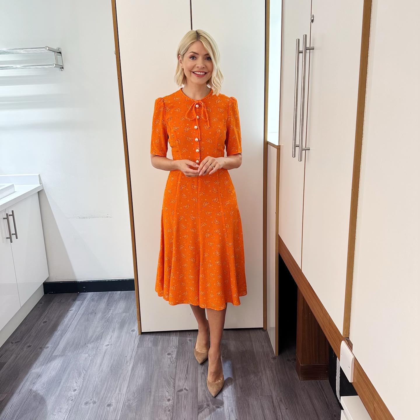where to get all Holly Willoughby This Morning dresses orange floral pearl button midi tea dress nude suede court shoes 2 May 2023 Photo Holly Willoughby