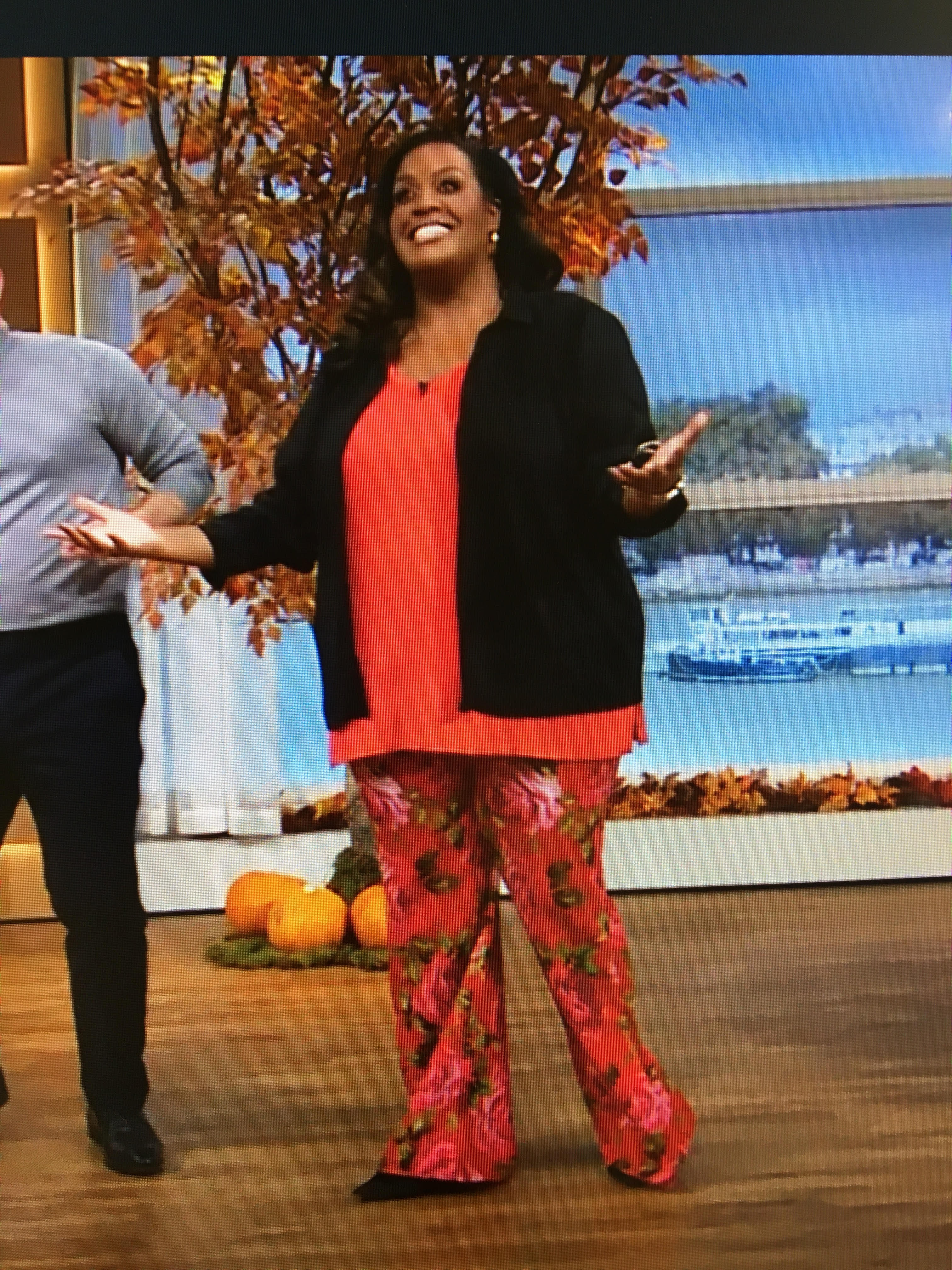 where to get all Alison Hammond This Morning outfits red rose print trousers black plisse shirt 25 October 2023 photo ITV