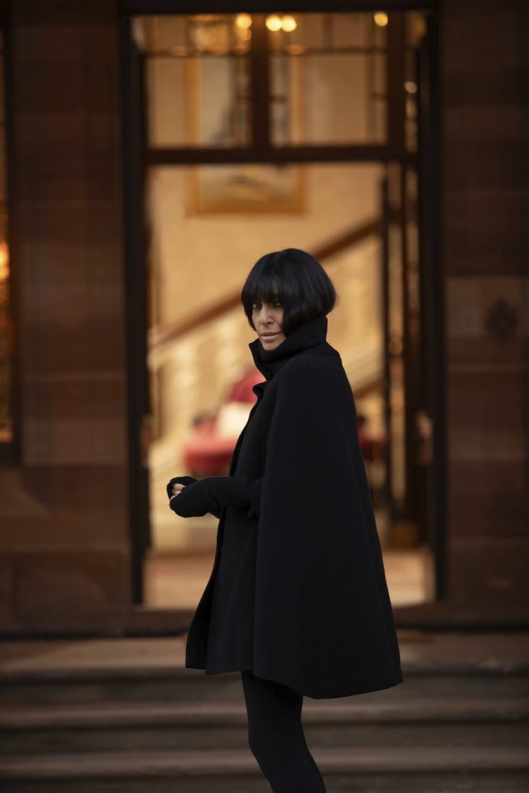 where to get all Claudia Winkleman The Traitors outfits black cape January 2024 photo BBC