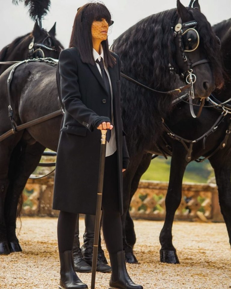 where to get all Claudia Winkleman The Traitors outfits black frock coat white shirt and black tie black leggings black suede ankle boots 17 January 2024 photo Claudia Winkleman