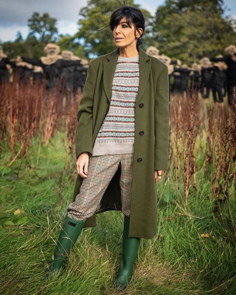 where to get all Claudia Winkleman The Traitors outfits green coat faIR ISLE JUMPER TWEED TROUSERS GREEN WELLINGTON boots 5 January 2024 photo Mara Cullara