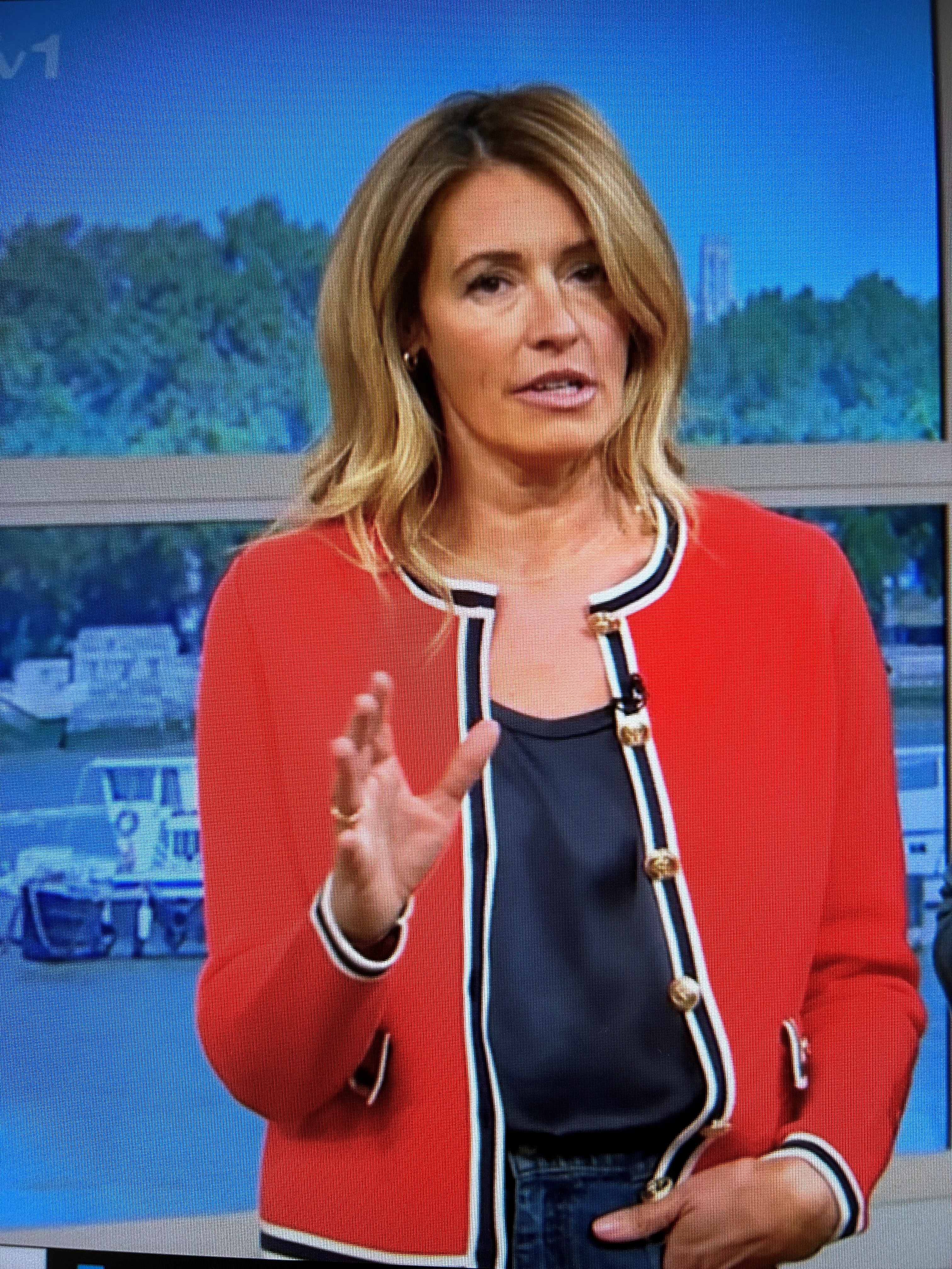 where to get all Cat Deeley This Morning outfits red knitted jacket blue silk vest blue jeans 18 April 2024 Photo ITV