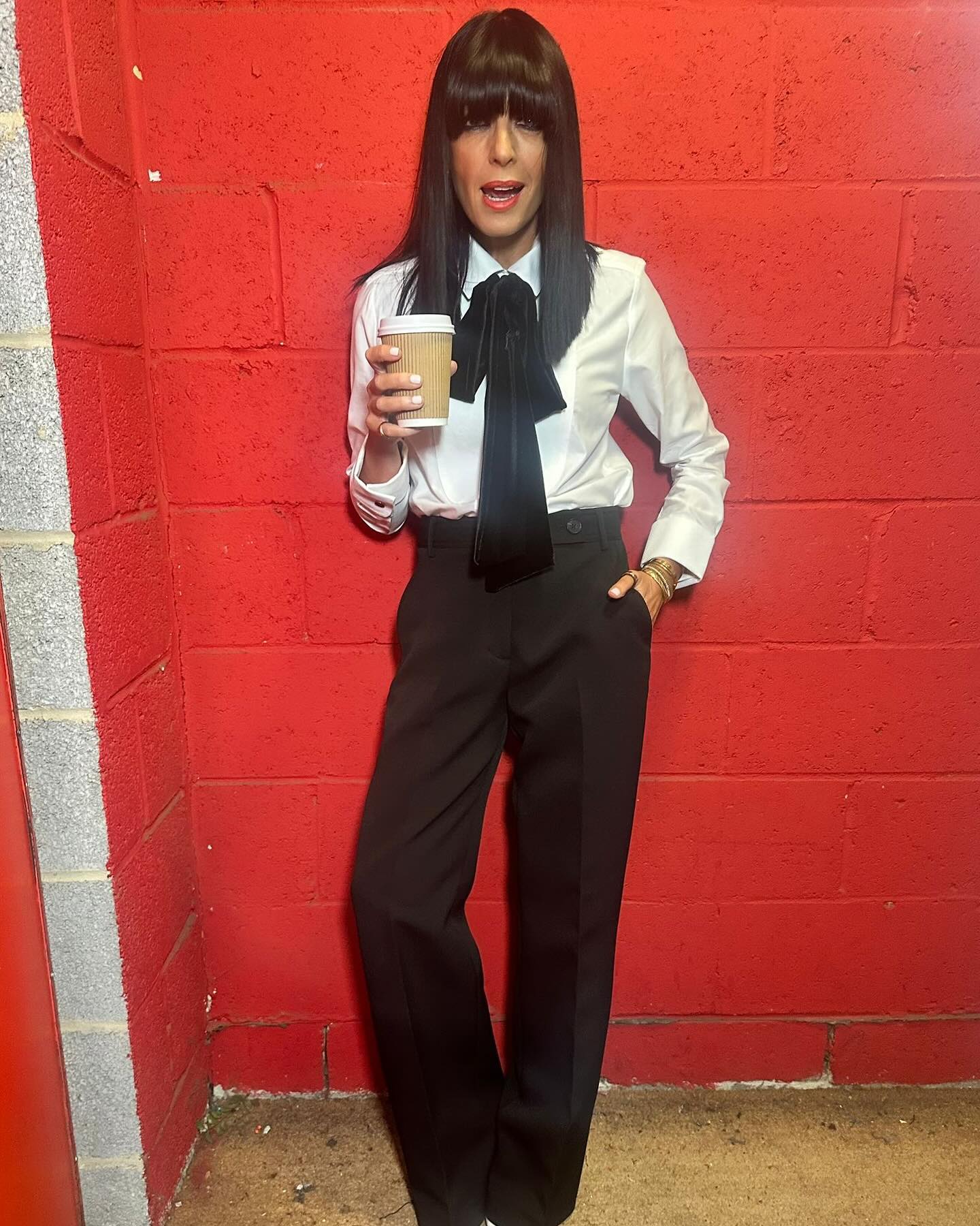 where to get all Claudia Winkleman Strictly Come Dancing outfits white silk shirt black bow black trousers what is Claudia wearing 14 December 20204 photo Claudia Winkleman