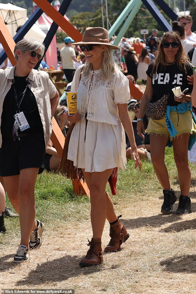 where to get all Holly willoughby outfits white dress with lace top brown hiking boots Glastonbury 27 June 2025 Photo Nick Edwards for Daily Mail