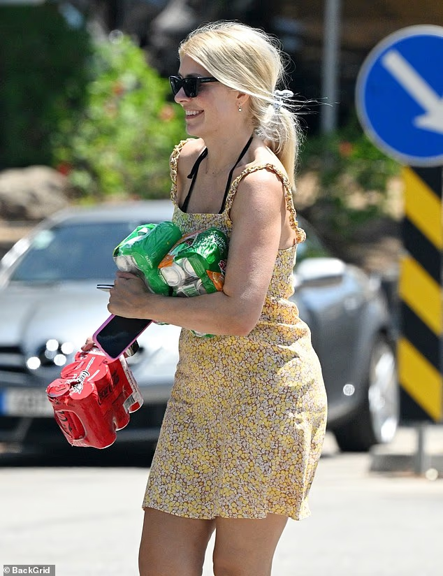 where to get all Holly Willoughby outfits yellow ruffle strap mini dress what is holly willoughby wearing 14 August 2025 photo Backgrid