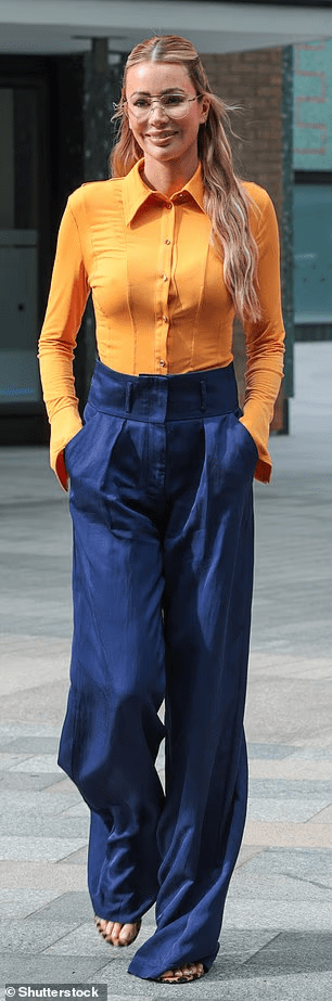 where to get all Olivia Attwood this Morning outfits yellow orange shirt blue pleat high waist trousers what is Olivia Wearing 1 August 2025 photo Shutterstock