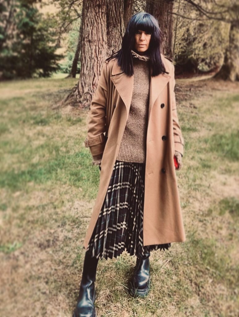 where to get all Claudia Winkleman Celebrity Traitors outfits dcamel fringe trim jumper black tartan skirt brown boots camel coat  23 October 2025 Photo Sinead McKeefry