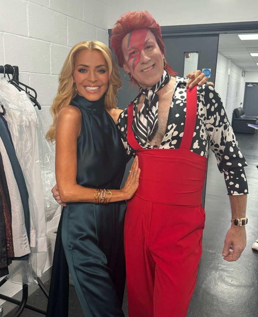 where to get all Tess Daly Strictly Come Dancing outfits teal green satin cape jumpsuit what is Tess wearing 25 October 2025 Photo Tess Daly