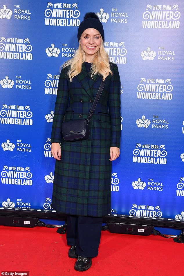 where to get all Holly Willoughby  outfits blck watch tartan coat blue bag black boots what is Holly wearing October 2025 Photo Gety Images