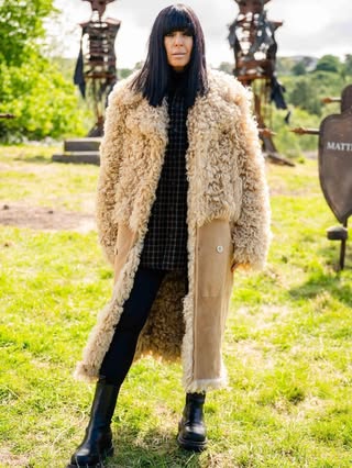 where to get all Claudia Winkleman The Traitors outfits black check shacket black leggings black hiking boots shearling sheepskin coat what is Claudia wearing8 January 2026 Photo BBC Sinead McKeefry