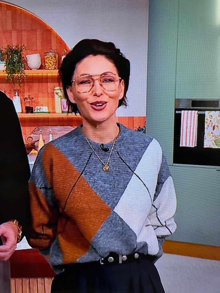 where to get all Emma Willia This Morning outfits grey brown argyle jumper black mini skirt what is Emma wearing 6  February 2026 Photo ITV